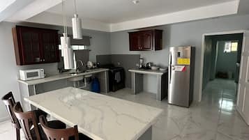 Fridge, microwave, stovetop, cookware/dishes/utensils