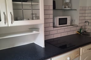 Microwave, stovetop, coffee/tea maker, toaster