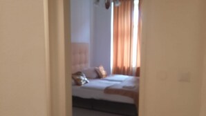 A bedroom with a bed, pillows, and curtains. - Affordable 2BR Apt. Near Rennweg & Belvedere (Vienna)