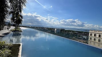 Outdoor pool, open 8:00 AM to 10:00 PM, lifeguards on site