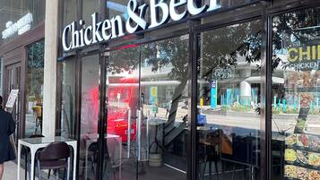 A storefront with a sign reading 'Chicken & Beer.'