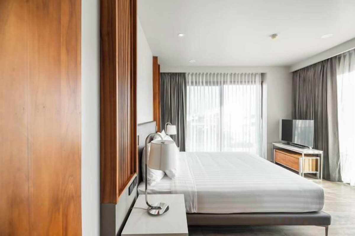 Premium bedding, desk, laptop workspace, iron/ironing board