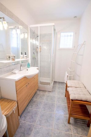 Shower, hair dryer, towels, soap