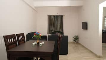 Premium Apartment | Living area | Flat-screen TV