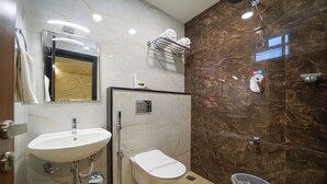 Family Room | Bathroom | Shower, hair dryer (on request), towels - Open Hotel by Olive - JK Residency (Bengaluru)