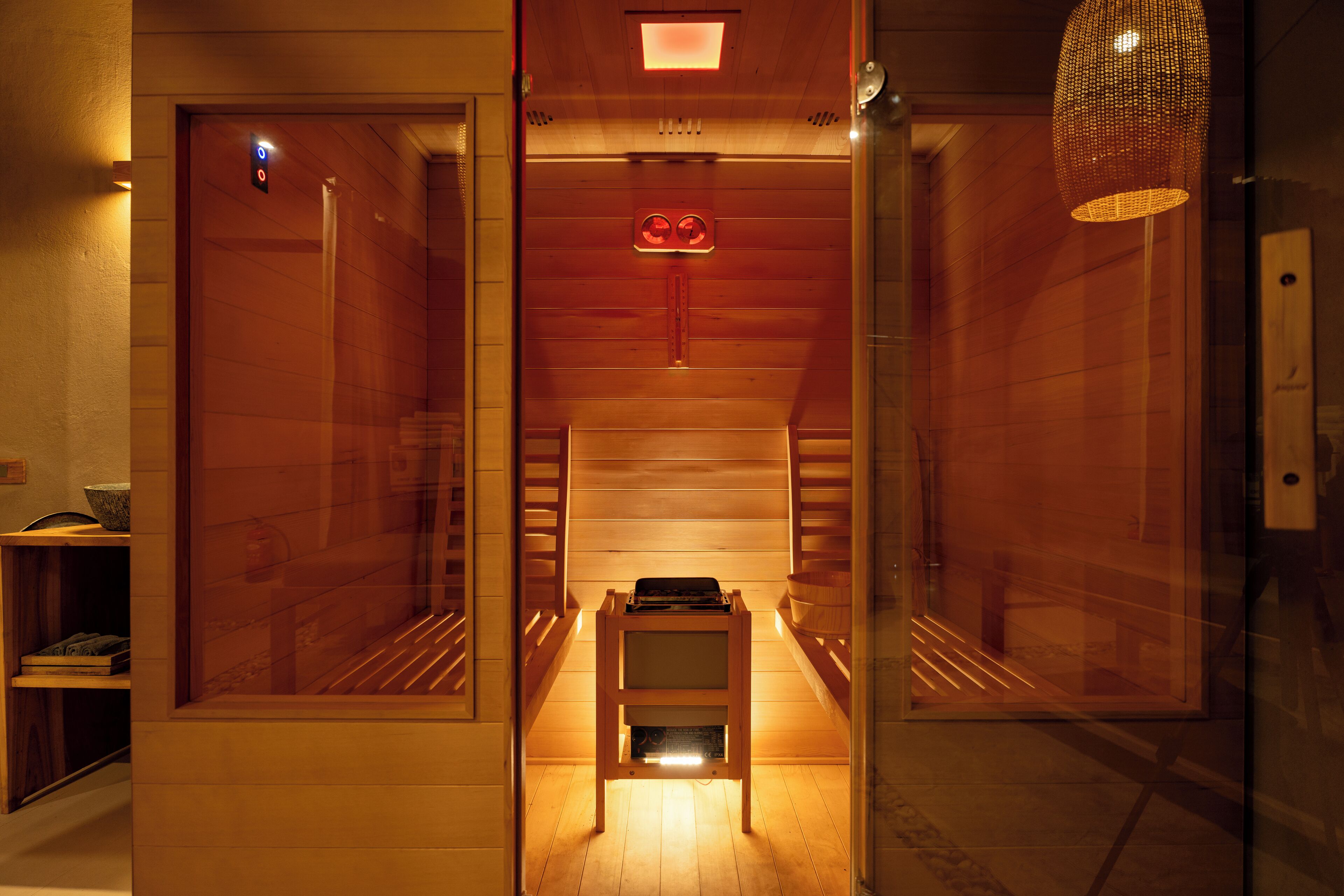 A modern interior with a wooden floor, a small table, and a bench.