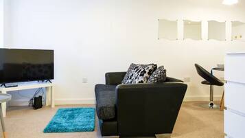 Comfort Apartment | Living area | 32-inch LED TV with digital channels