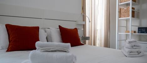 Deluxe Room, Balcony, City View | Premium bedding, in-room safe, individually decorated