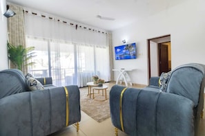Deluxe Apartment | Living area | 24-inch Smart TV with digital channels - Lux Suites Vee Xanadu Luxury Apartments (Mombasa)