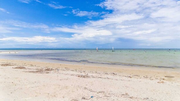 A beach with clear skies and calm waters. - Lux Suites Vee Xanadu Luxury Apartments (Mombasa)