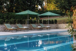 Indoor pool, seasonal outdoor pool, pool umbrellas, pool loungers