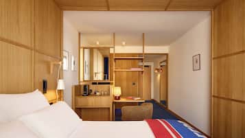 Habitación superior | Ropa de cama de alta calidad, caja fuerte, escritorio