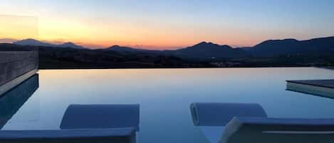 Seasonal outdoor pool, pool umbrellas, sun loungers