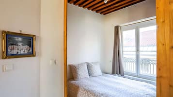 1 bedroom, desk, iron/ironing board, travel crib