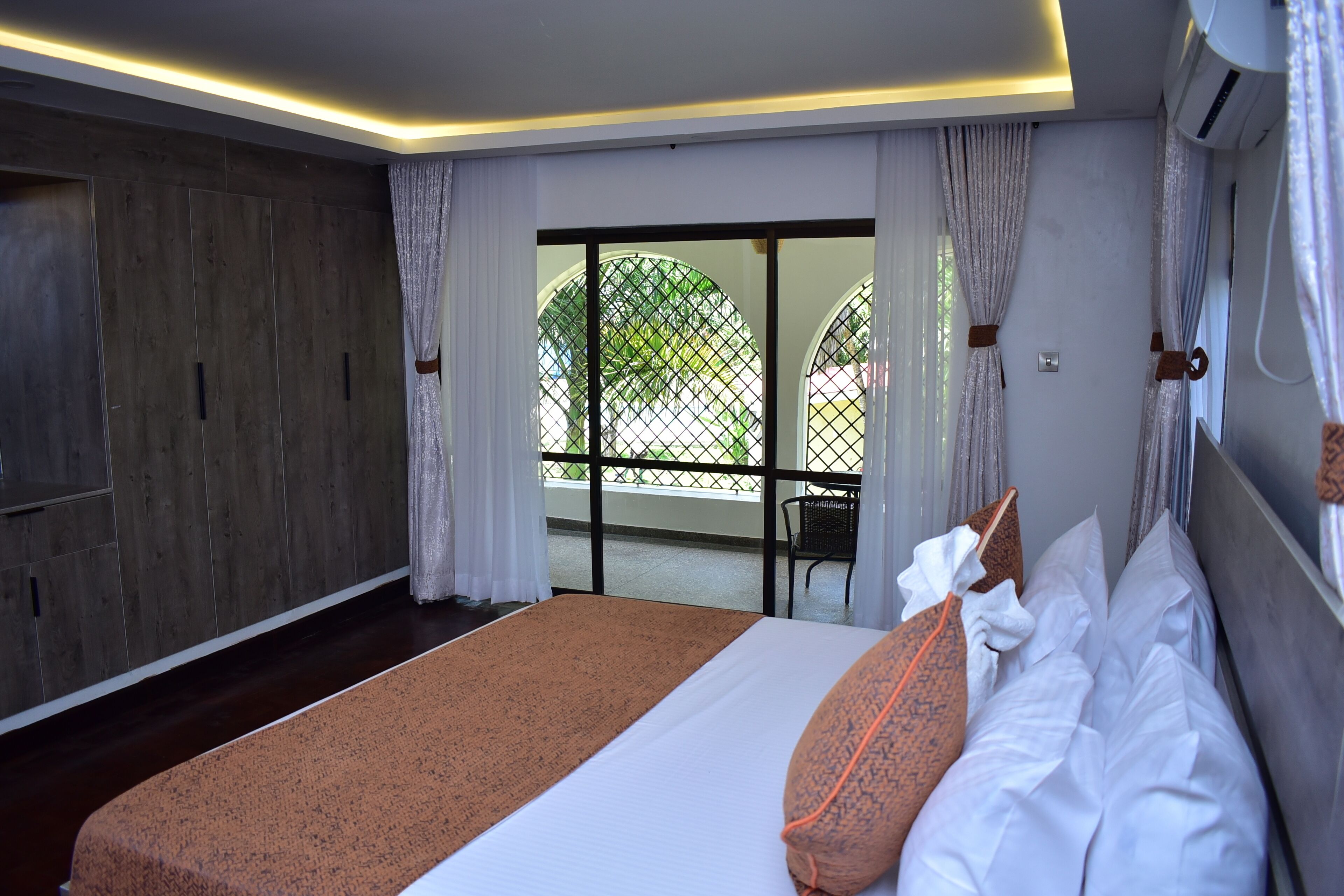 Premium bedding, memory-foam beds, desk, laptop workspace