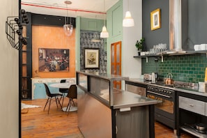 Fridge, microwave, oven, stovetop - Vintage Chic Apartment: Industrial-Inspired Living (Cape Town)