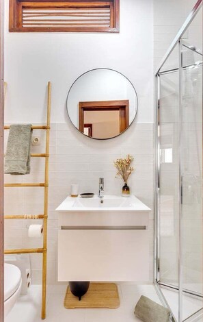 Shower, hair dryer, towels, soap