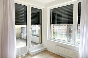 Enjoy the view from this corner room with two large windows and a white radiator.