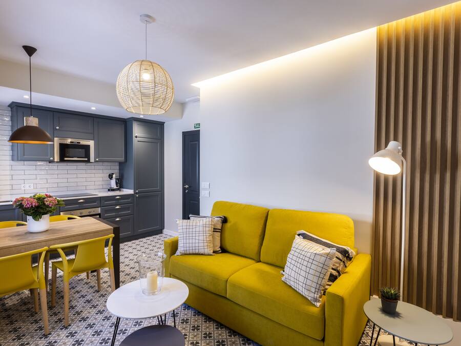 Apartment, City View | Living area | 32-inch Smart TV with cable channels