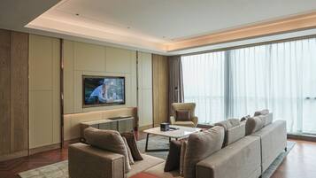 Executive Studio Suite, 1 King Bed, City View | Living area | 55-inch LCD TV with satellite channels