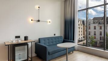 Suite, 1 King Bed with Sofa bed, City View | Premium bedding, minibar, in-room safe, desk