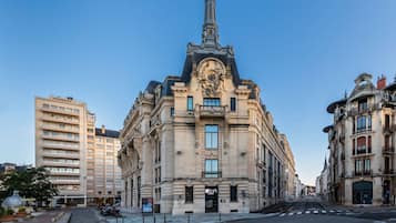 Standing tall with a prominent clock tower, this historic landmark features classical columns and ornate detailing.