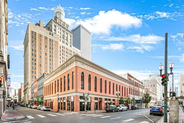 A historic building with a classic architectural style, featuring arched windows and a symmetrical facade.