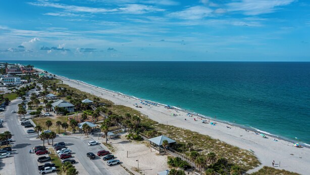 A coastal hotel with a beach view, parking, and a boardwalk. - Heated Pool, Canal Front, Kayaks - Paradise Awaits!  (Port Charlotte)