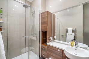 Shower, hair dryer, towels, soap
