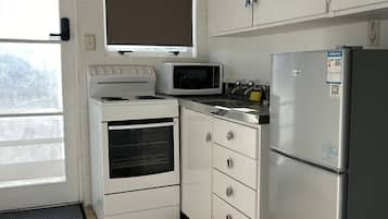 Apartamento família | Cozinha privada | Frigobar, micro-ondas, cooktop, chaleira elétrica