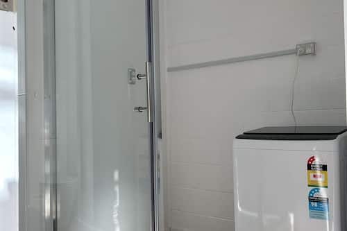 Family Apartment | Bathroom | Shower, hair dryer, towels, shampoo