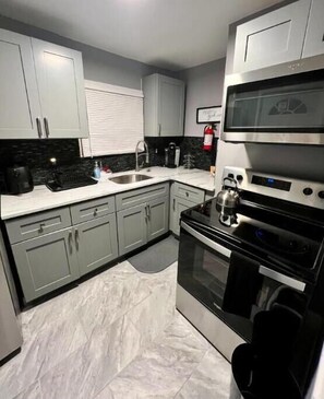 Microwave, oven, stovetop, cookware/dishes/utensils - Manor by the Bay - Within Walking Distance to Boardwalk (Wildwood)