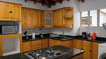 Fridge, microwave, blender, cookware/dishes/utensils