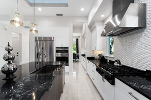 Fridge, microwave, oven, stovetop - Sparkling Serenity | Private Pool | 16-seat Theater Room | Arcade Room | Space Themed Bedroom (Kissimmee)