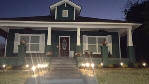A two-story house with a front porch, a front door, and a mailbox. - Macon a Little Music House.  Family-sized Home <1 Mile to Mercer & Downtown (Macon)