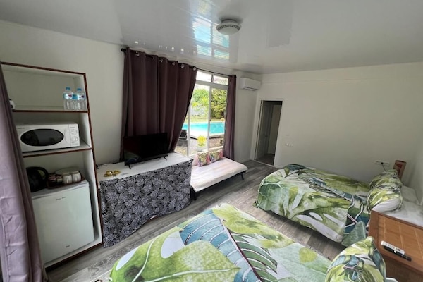 Classic Quadruple Room, Pool View, Garden Area | Individually decorated, individually furnished, iron/ironing board