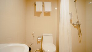 A bathroom with a toilet, a shower, and a bathtub. - Portola Arabia Hotel Banda Aceh  (Banda Aceh)