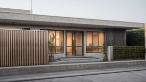 A modern building with a flat roof, large windows, and a concrete facade. - D'Pavilion Malioboro (Yogyakarta)