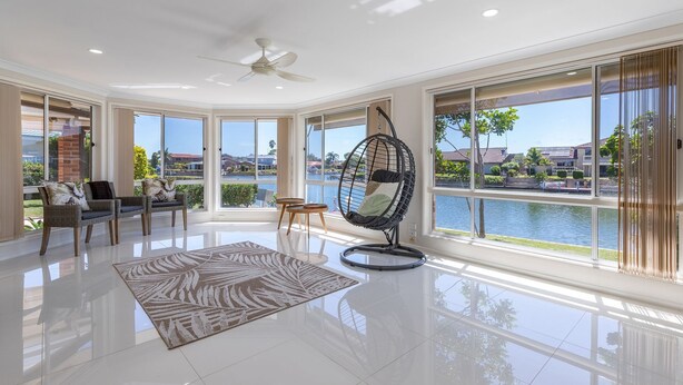 A spacious room with a large window, a hanging chair, and a ceiling fan. - 114 Elizabeth on the Forster Keys (Forster)