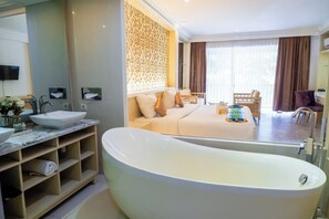 Separate bathtub and shower, rainfall showerhead, hair dryer, towels - The Ululani (Pecatu)