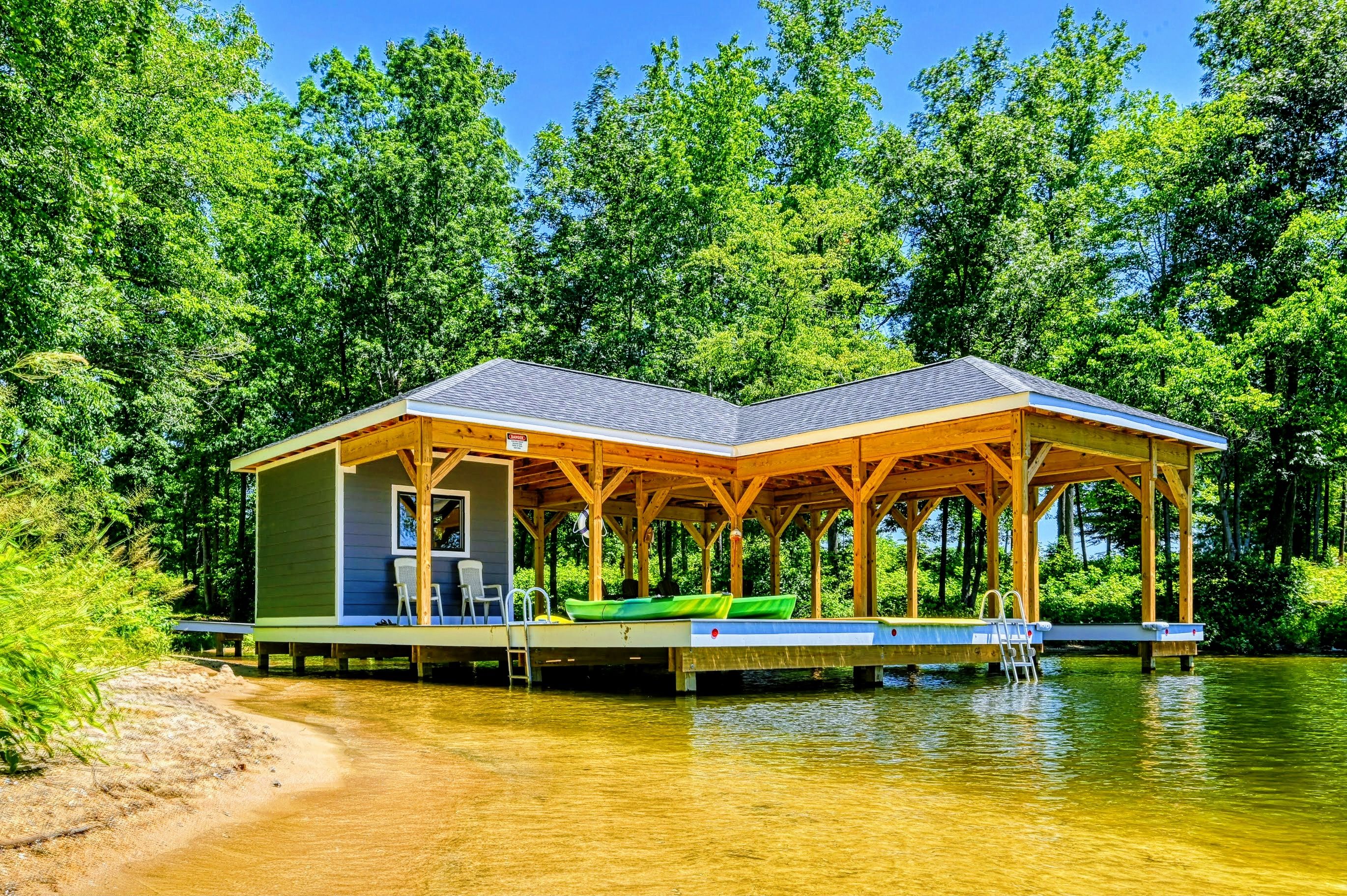 Charming lakeside boathouse with seating area and easy water access, perfect for relaxation and recreation