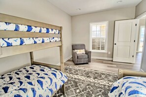 Bunk Room - Sleeps four with room to spare, plush rug for floor time, and an easy walk to the lower-level bath.