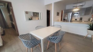 A modern kitchen with a microwave, stove, and sink. - Spacious 3BD Beach House 2 Blocks from Ocean Park (San Juan)