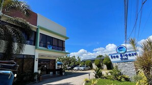 A hotel entrance with a sign reading "Sea Breeze Hotel." - Argao Seabreeze Hotel powered by Cocotel (Argao)