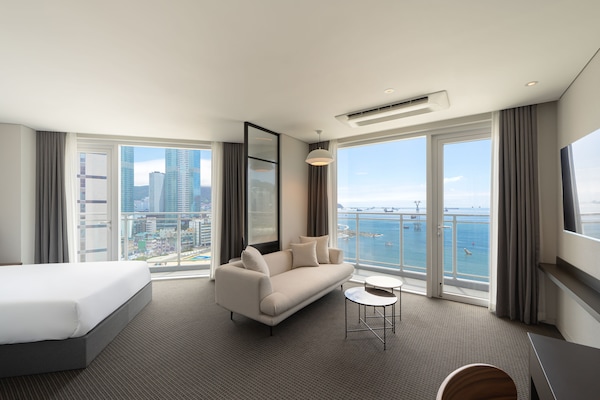 Hypo-allergenic bedding, desk, laptop workspace, blackout curtains