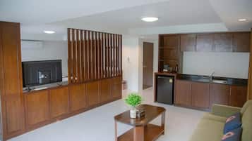 Family Suite, 1 Bedroom | Living area | 42-inch LCD TV with cable channels