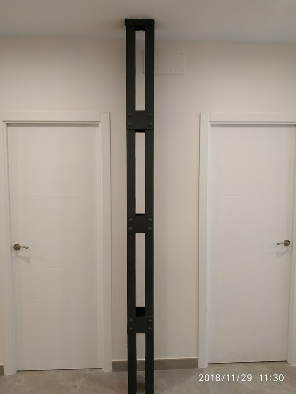 A white door with a black metal handle and a white door with a black metal handle. - Luxury Center (Seville)