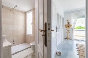 Shower, hair dryer, towels, soap