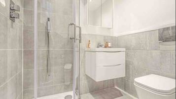 Shower, hair dryer, towels, soap