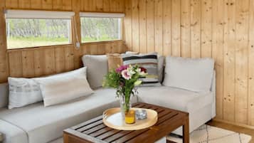 Three Bedroom Cottage. | Living area | Flat-screen TV